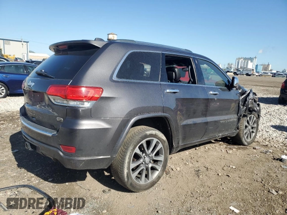 2017 Jeep Grand Cherokee Overland with VIN 1C4RJFCG0HC762612, listed as a Copart auction lot 57400095 with 122,702 mi miles and Salvage title. Bid and sale history available at DreamBid. Image 3.