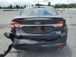 2017 Ford Fusion Titanium z VIN 3FA6P0K92HR192881, wystawiony jako Copart lot #61190515 z przebiegiem 109 834 mil mil oraz Szkoda całkowita • Salvage title. Historia ofert i sprzedaży dostępna na DreamBid. Obrazek 6.