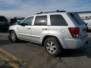 2009 Jeep Grand Cherokee Laredo with VIN 1J8HR48P89C552691, listed as a Copart auction lot 82080964 with 100,876 mi miles and Salvage Title. Bid and sale history available at carsss.com. Image 2.