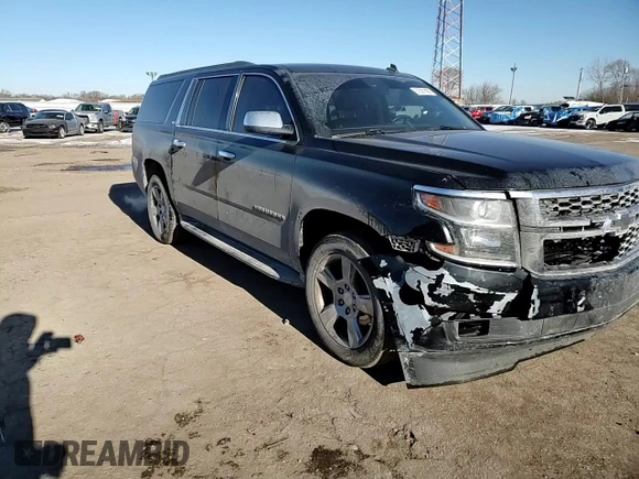 2015 Chevrolet Suburban LT with VIN 1GNSKJKC2FR274506, listed as a Copart auction lot 87881695 with 196,506 mi miles and Salvage Title. Bid and sale history available at DreamBid. Image 12.