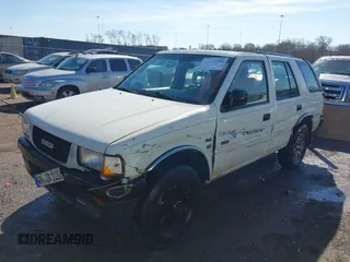 1997 Isuzu Rodeo z VIN 4S2CK58V2V4300048, wystawiony jako IAAI lot #41446738 z przebiegiem 195 609 mil mil oraz . Historia ofert i sprzedaży dostępna na DreamBid. Obrazek 2.