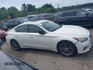 2015 Infiniti Q50 Premium with VIN JN1BV7AR5FM390985, listed as a IAAI auction lot 42641031 with 117,060 mi miles and . Bid and sale history available at DreamBid. Image 13.