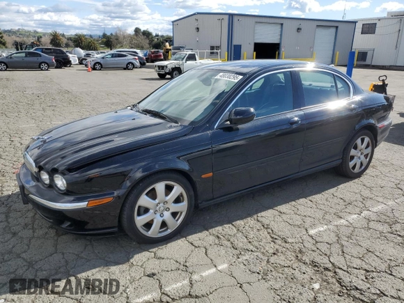 2004 Jaguar X-Type with VIN SAJEA51C74WD56736, listed as a Copart auction lot 48038295 with 115,817 mi miles and Salvage Title. Bid and sale history available at DreamBid. Image 1.