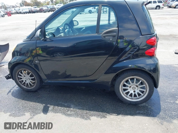 2012 Smart fortwo Pure z VIN WMEEJ3BA1CK556029, wystawiony jako IAAI lot #42173735 z przebiegiem 85 133 mil mil oraz . Historia ofert i sprzedaży dostępna na DreamBid. Obrazek 14.