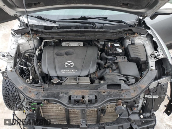 2015 Mazda CX-5 Sport with VIN JM3KE4BEXF0499688, listed as a Copart auction lot 88988095 with 258,460 mi miles and Salvage title. Bid and sale history available at DreamBid. Image 12.