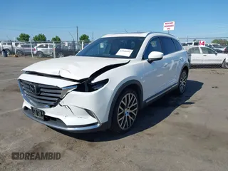 2017 Mazda CX-9 Grand Touring with VIN JM3TCBDY3H0132351, listed as a IAAI auction lot 42346910 with 124,990 mi miles and . Bid and sale history available at DreamBid. Image 2.