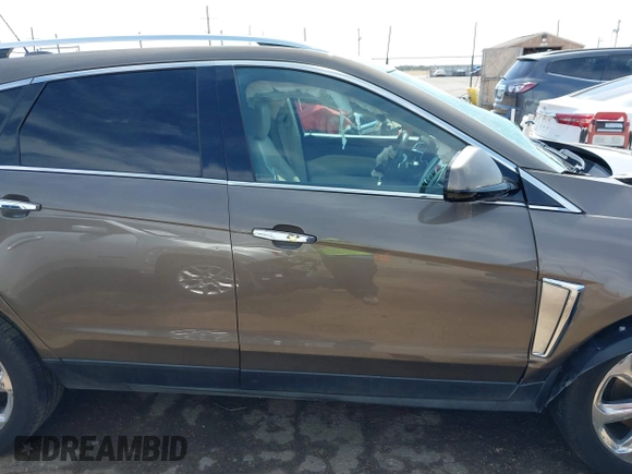 2016 Cadillac SRX Performance Collection z VIN 3GYFNCE39GS512286, wystawiony jako IAAI lot #42392467 z przebiegiem 95 708 mil mil oraz . Historia ofert i sprzedaży dostępna na DreamBid. Obrazek 13.