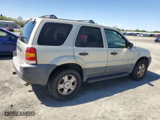 2004 Ford Escape XLT with VIN 1FMYU03104KA53587, listed as a Copart auction lot 51777385 with 154,102 mi miles and Salvage Title. Bid and sale history available at carsss.com. Image 3.