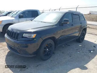 2015 Jeep Grand Cherokee Summit with VIN 1C4RJFJM1FC867861, listed as a IAAI auction lot 42034207 with 92,205 mi miles and . Bid and sale history available at DreamBid. Image 2.