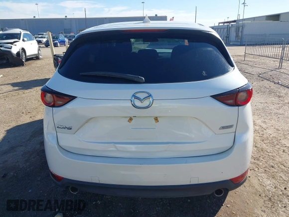 2019 Mazda CX-5 Touring with VIN JM3KFACM4K1668352, listed as a IAAI auction lot 41481291 with 65,901 mi miles and . Bid and sale history available at carsss.com. Image 16.