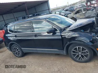 2021 Volkswagen Tiguan SE with VIN 3VV3B7AX3MM157702, listed as a IAAI auction lot 41888479 with 51,807 mi miles and . Bid and sale history available at DreamBid. Image 12.