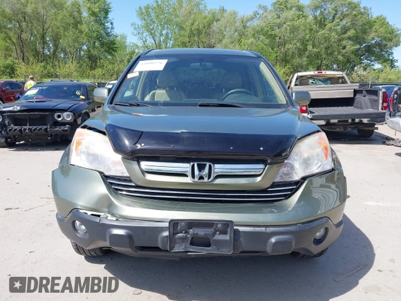 2007 Honda CR-V EX-L z VIN JHLRE387X7C073092, wystawiony jako IAAI lot #42090276 z przebiegiem 150 297 mil mil oraz . Historia ofert i sprzedaży dostępna na DreamBid. Obrazek 13.