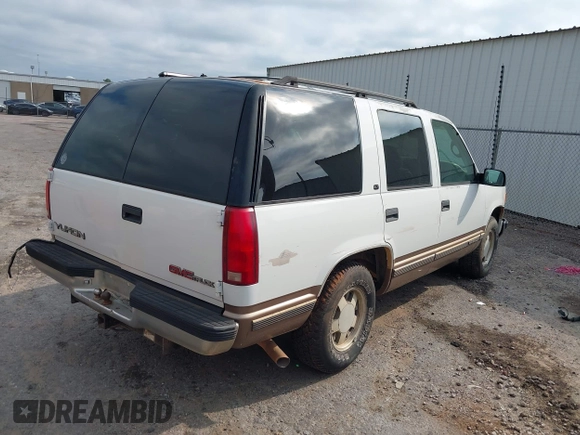 1997 GMC Yukon with VIN 1GKEC13R8VJ761054, listed as a IAAI auction lot 40070531 with 237,043 mi miles. Bid and sale history available at carsss.com. Image 4.