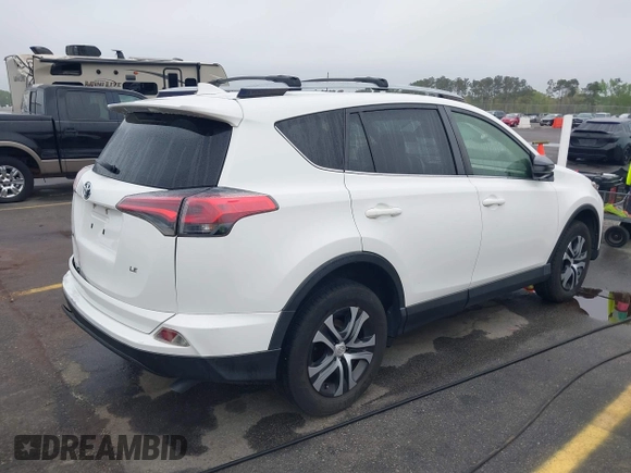 2017 Toyota RAV4 LE with VIN JTMZFREV9HJ704296, listed as a IAAI auction lot 41876996 with 85,605 mi miles and . Bid and sale history available at DreamBid. Image 4.