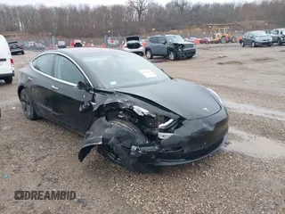 2018 Tesla Model 3 Long Range Battery with VIN 5YJ3E1EB1JF127289, listed as a IAAI auction lot 41484253 with 60,577 mi miles and . Bid and sale history available at DreamBid. Image 1.