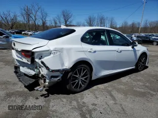 2023 Toyota Camry SE with VIN 4T1G11AKXPU815080, listed as a Copart auction lot 53675035 with 27,634 mi miles and Salvage Title. Bid and sale history available at DreamBid. Image 3.