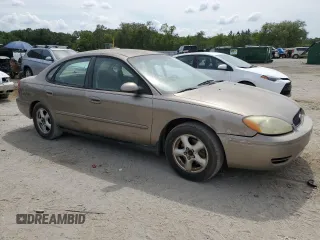 2004 Ford Taurus SE z VIN 1FAFP53U44A122559, wystawiony jako Copart lot #55606595 z przebiegiem Nie podano mil oraz Szkoda całkowita • Salvage title. Historia ofert i sprzedaży dostępna na DreamBid. Obrazek 4.