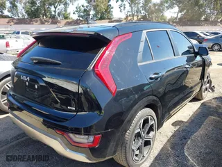 2023 Kia Niro SX Touring with VIN KNDCT3LE6P5038102, listed as a IAAI auction lot 41710555 with 57,669 mi miles. Bid and sale history available at carsss.com. Image 4.