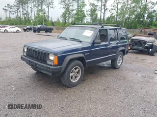 1996 Jeep Cherokee SE z VIN 1J4FJ28S5TL129065, wystawiony jako IAAI lot #42231133 z przebiegiem 225 320 mil mil oraz . Historia ofert i sprzedaży dostępna na DreamBid. Obrazek 2.