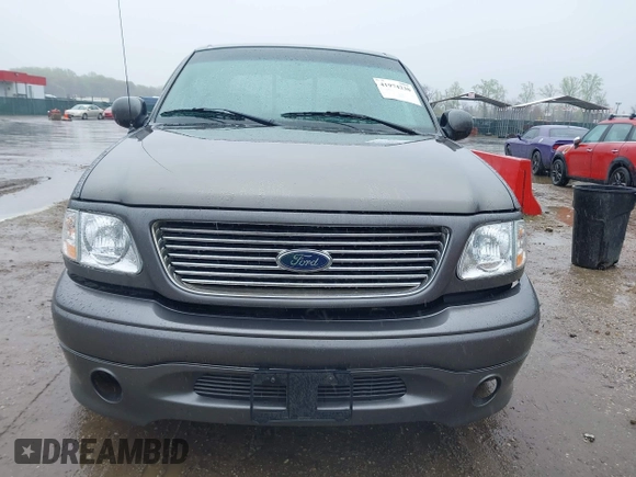 2002 Ford F-150 Harley Davidson with VIN 1FTRW07392KD29874, listed as a IAAI auction lot 41974230 with 163,279 mi miles. Bid and sale history available at carsss.com. Image 12.