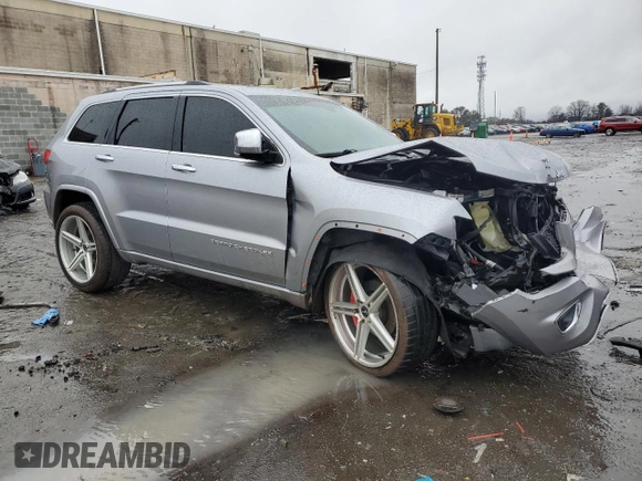 2014 Jeep Grand Cherokee Overland with VIN 1C4RJECG9EC341865, listed as a Copart auction lot 44354615 with 141,601 mi miles and Salvage Title. Bid and sale history available at carsss.com. Image 4.
