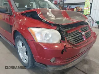 2009 Dodge Caliber SXT with VIN 1B3HB48A79D108706, listed as a IAAI auction lot 41555213 with 159,577 mi miles and . Bid and sale history available at DreamBid. Image 12.