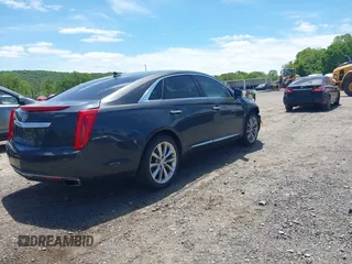 2013 Cadillac XTS Luxury z VIN 2G61R5S33D9101434, wystawiony jako IAAI lot #42290199 z przebiegiem 48 075 mil mil oraz . Historia ofert i sprzedaży dostępna na DreamBid. Obrazek 4.