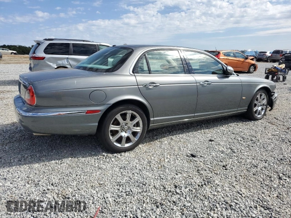 2006 Jaguar XJ with VIN SAJWA71B06SH03941, listed as a Copart auction lot 76013984 with 0 mi miles and Salvage Title. Bid and sale history available at carsss.com. Image 3.