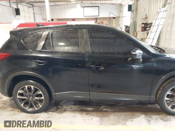 2016 Mazda CX-5 Grand Touring with VIN JM3KE2DY9G0705127, listed as a IAAI auction lot 41412910 with 181,993 mi miles. Bid and sale history available at carsss.com. Image 13.