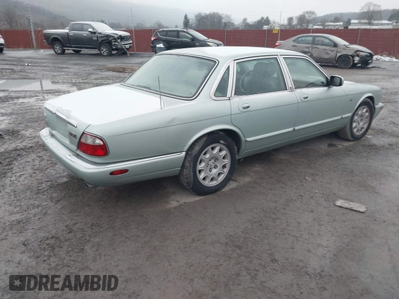 1998 Jaguar XJ with VIN SAJHN1242WC819689, listed as a IAAI auction lot 41148530 with 60,143 mi miles and . Bid and sale history available at DreamBid. Image 4.