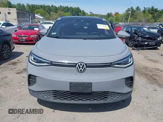 2022 Volkswagen ID.4 Pro S z VIN WVGGNPE24NP059968, wystawiony jako IAAI lot #42210089 z przebiegiem 36 860 mil mil oraz . Historia ofert i sprzedaży dostępna na DreamBid. Obrazek 12.