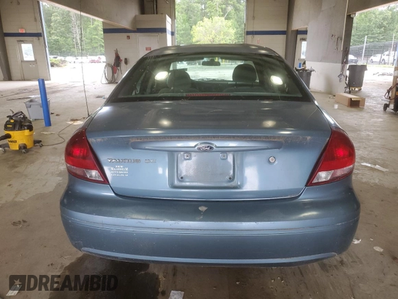 2007 Ford Taurus SE with VIN 1FAFP53U17A215432, listed as a Copart auction lot 64029215 with 121,190 mi miles and Salvage title. Bid and sale history available at DreamBid. Image 6.