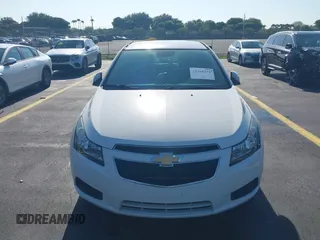 2014 Chevrolet Cruze 2LT z VIN 1G1PE5SB4E7340318, wystawiony jako IAAI lot #42268044 z przebiegiem Nie podano mil oraz . Historia ofert i sprzedaży dostępna na DreamBid. Obrazek 12.