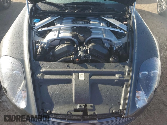 2005 Aston Martin DB9 z VIN SCFAD01A75GA02198, wystawiony jako Copart lot #75564554 z przebiegiem Nie podano mil oraz Nie do naprawy • Non repairable. Historia ofert i sprzedaży dostępna na DreamBid. Obrazek 11.