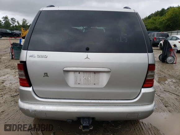 2000 Mercedes-Benz M-Class with VIN 4JGAB54E5YA202352, listed as a Copart auction lot 73734624 with 295,895 mi miles and Salvage Title. Bid and sale history available at carsss.com. Image 6.