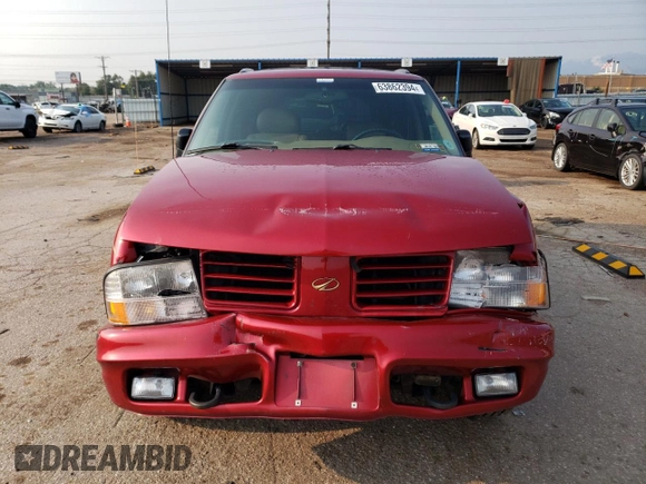 2000 Oldsmobile Bravada z VIN 1GHDT13W6Y2308007, wystawiony jako Copart lot #63862394 z przebiegiem 142 617 mil mil oraz Szkody całkowita. Historia ofert i sprzedaży dostępna na DreamBid. Obrazek 5.