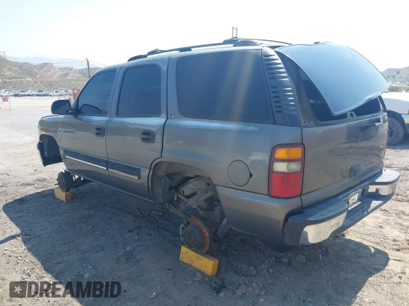 2001 Chevrolet Tahoe LS z VIN 1GNEC13T51J153677, wystawiony jako IAAI lot #42459552 z przebiegiem 201 209 mil mil oraz . Historia ofert i sprzedaży dostępna na DreamBid. Obrazek 3.