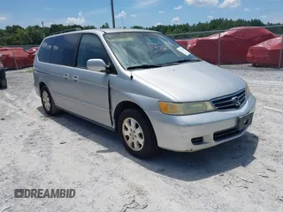 2002 Honda Odyssey EX with VIN 2HKRL18632H557214, listed as a IAAI auction lot 42576826 with 237,719 mi miles and . Bid and sale history available at DreamBid. Image 1.
