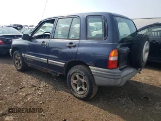 2001 Chevrolet Tracker z VIN 2CNBJ13C616955326, wystawiony jako Copart lot #64105184 z przebiegiem 138 156 mil mil oraz Tytuł czysty. Historia ofert i sprzedaży dostępna na DreamBid. Obrazek 2.