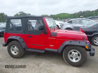 1999 Jeep Wrangler SE z VIN 1J4FY29P5XP487111, wystawiony jako IAAI lot #42125867 z przebiegiem 156 804 mil mil oraz . Historia ofert i sprzedaży dostępna na DreamBid. Obrazek 13.