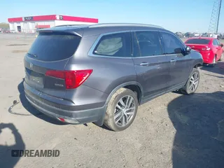 2017 Honda Pilot Touring with VIN 5FNYF5H97HB023919, listed as a IAAI auction lot 41864959 with 70,360 mi miles. Bid and sale history available at carsss.com. Image 4.