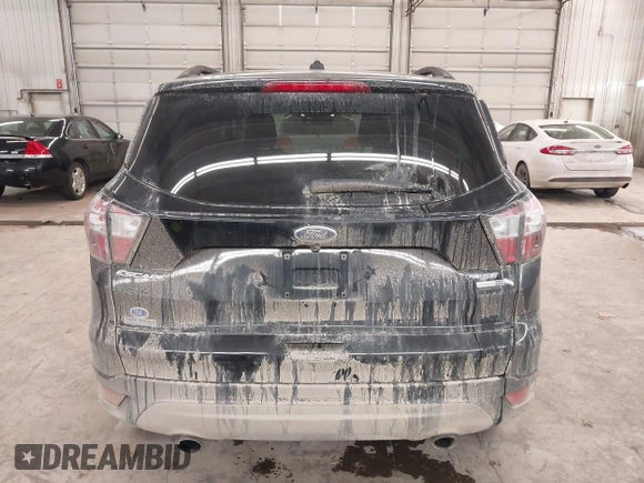 2018 Ford Escape SE z VIN 1FMCU9GD0JUC25636, wystawiony jako IAAI lot #40996760 z przebiegiem 70 097 mil mil oraz . Historia ofert i sprzedaży dostępna na DreamBid. Obrazek 17.