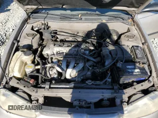 2000 Chevrolet Prizm z VIN 1Y1SK5284YZ407566, wystawiony jako Copart lot #86148464 z przebiegiem 193 844 mil mil oraz Szkoda całkowita • Salvage title. Historia ofert i sprzedaży dostępna na DreamBid. Obrazek 11.