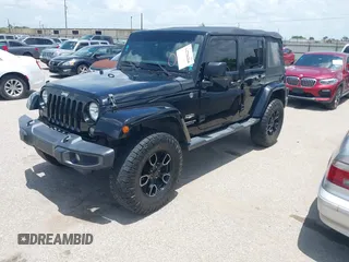 2015 Jeep Wrangler Unlimited Sahara with VIN 1C4HJWEG6FL572674, listed as a IAAI auction lot 42736266 with 97,024 mi miles and . Bid and sale history available at DreamBid. Image 2.