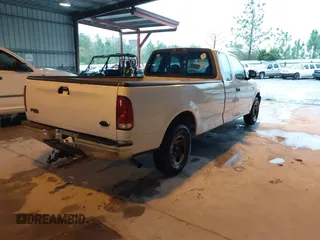 2002 Ford F-150 XL with VIN 1FTRX17L52NA38404, listed as a IAAI auction lot 41871731 with 366,564 mi miles. Bid and sale history available at carsss.com. Image 4.