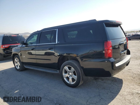 2015 Chevrolet Suburban LT with VIN 1GNSCJKC9FR732720, listed as a Copart auction lot 62564765 with 99,194 mi miles and Salvage title. Bid and sale history available at DreamBid. Image 2.