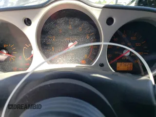2005 Nissan 350Z Enthusiast z VIN JN1AZ34DX5M607390, wystawiony jako Copart lot #57277905 z przebiegiem 97 629 mil mil oraz Tytuł czysty. Historia ofert i sprzedaży dostępna na DreamBid. Obrazek 9.