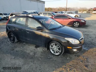 2012 Hyundai Elantra Touring SE with VIN KMHDC8AE0CU137417, listed as a Copart auction lot 47947295 with 141,259 mi miles and Salvage Title. Bid and sale history available at carsss.com. Image 4.