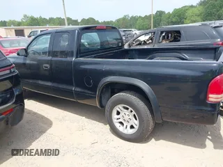 2003 Dodge Dakota z VIN 1D7HL12X73S381323, wystawiony jako IAAI lot #42161329 z przebiegiem 219 083 mil mil oraz . Historia ofert i sprzedaży dostępna na DreamBid. Obrazek 13.
