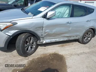 2016 Hyundai Santa Fe z VIN 5XYZTDLB0GG338313, wystawiony jako IAAI lot #42103866 z przebiegiem 111 555 mil mil oraz . Historia ofert i sprzedaży dostępna na DreamBid. Obrazek 6.